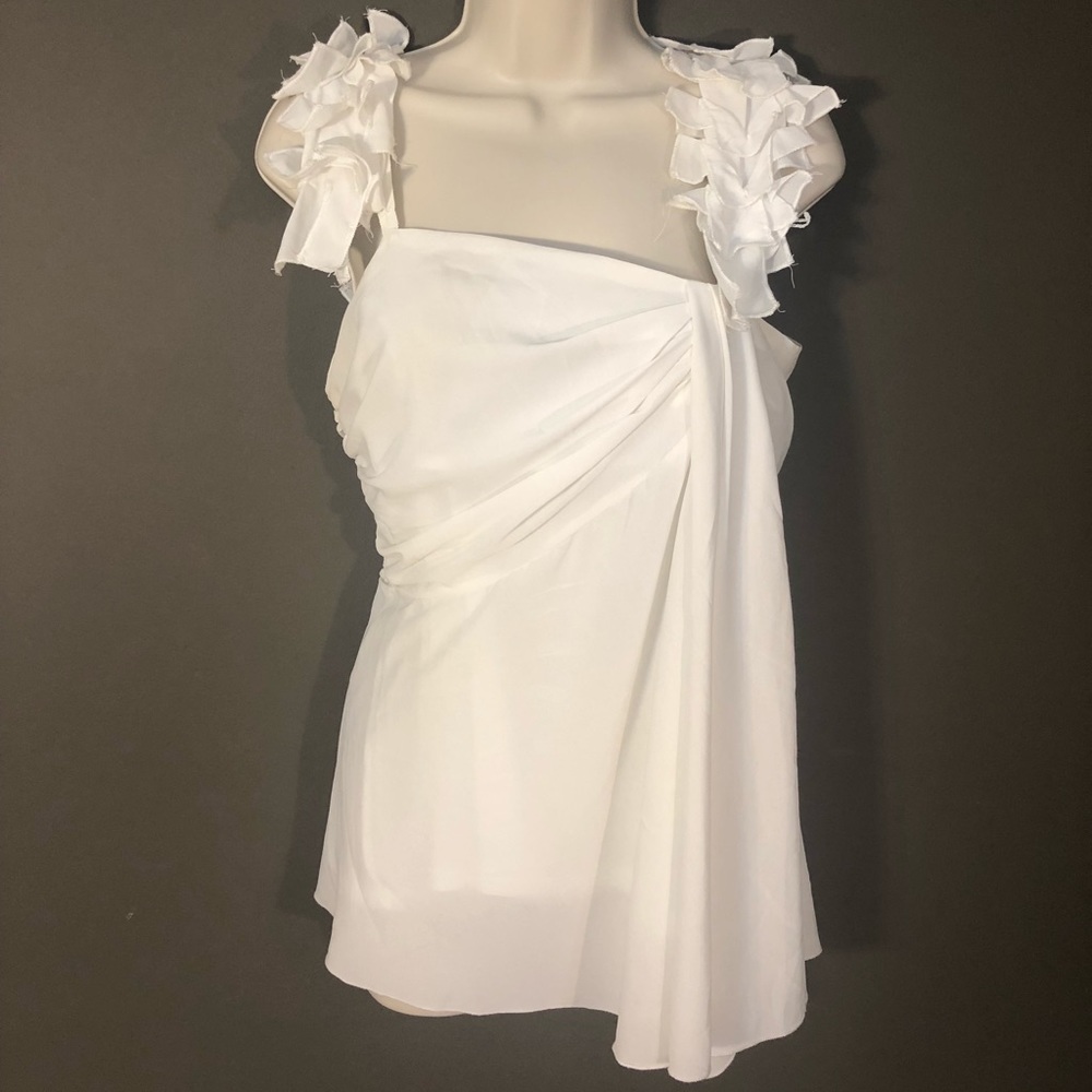 White sleeveless blouse- float